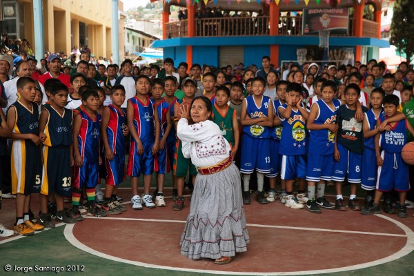 Tlahuitotepec's first female mayor, Sofia Robles, takes the opening shot at the basketball tournament.