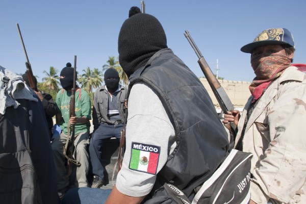 Community militias in Mexican state of Guerrero, present suspected criminals in El Mezon plaza.